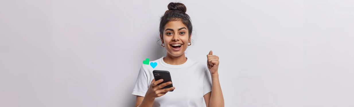 A happy woman using her phone