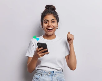 A happy woman using her phone