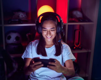 A woman gaming on mobile phone.