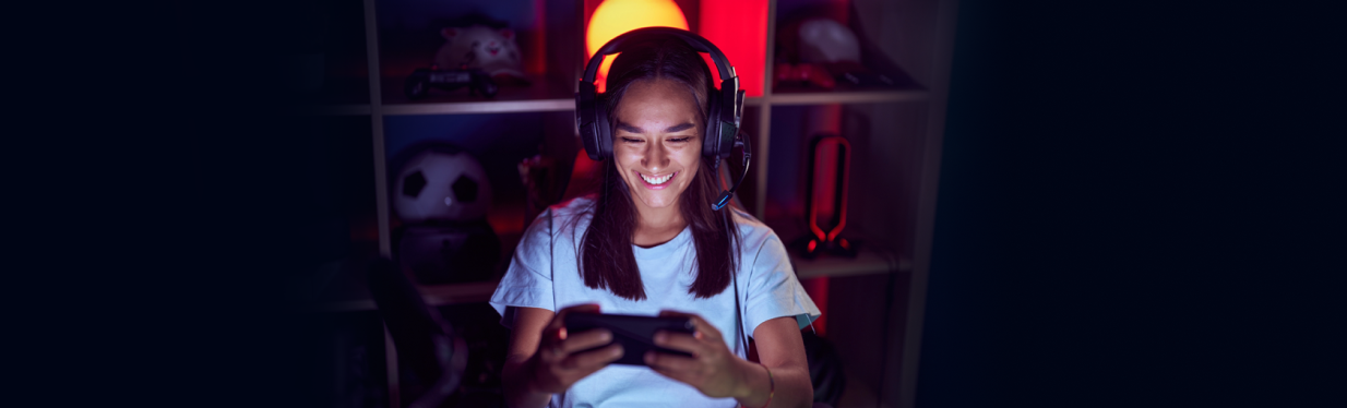 A woman gaming on mobile phone.